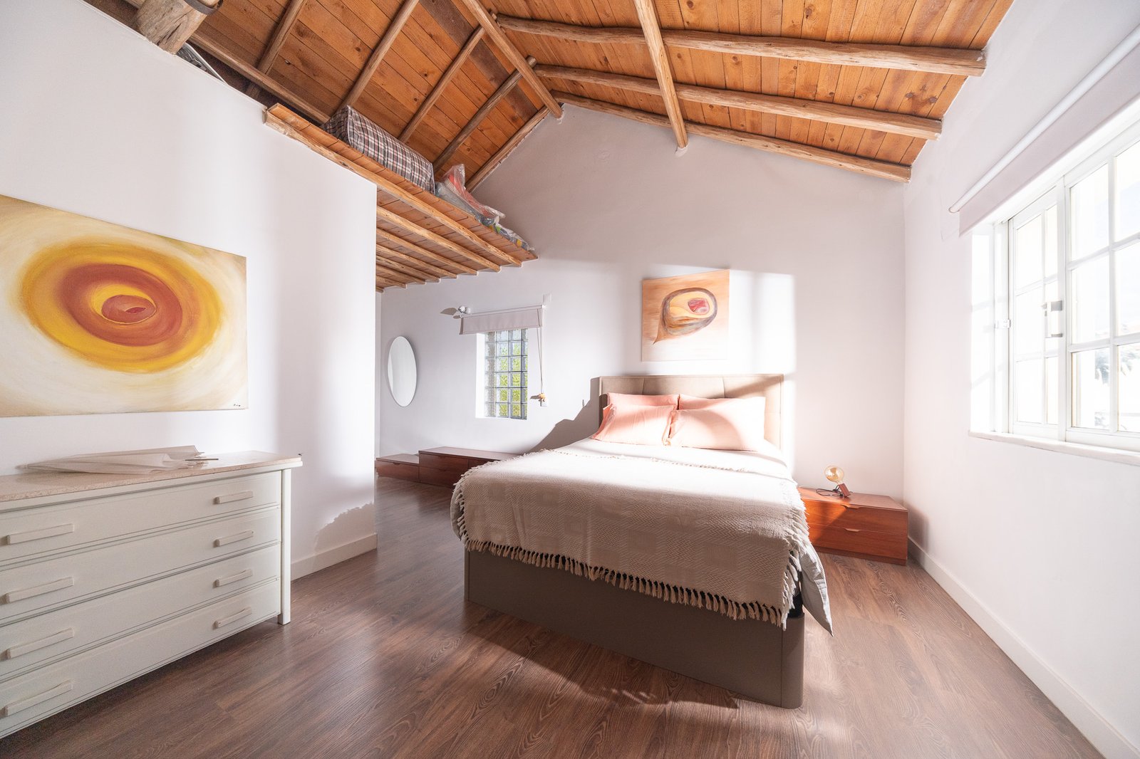 The Wooden Cabin — bedroom under a timber roof
