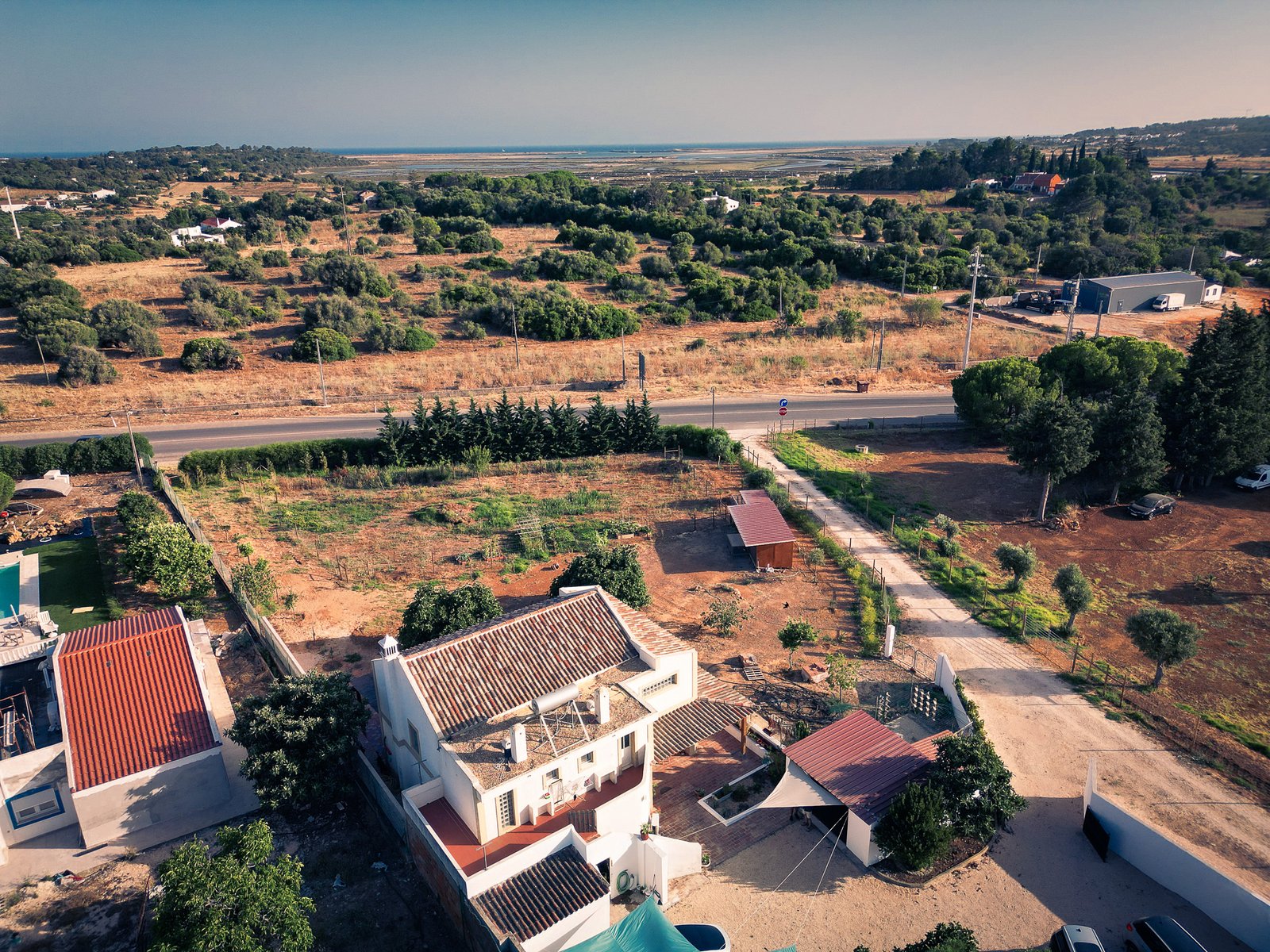 Drone view over the property toward the sea