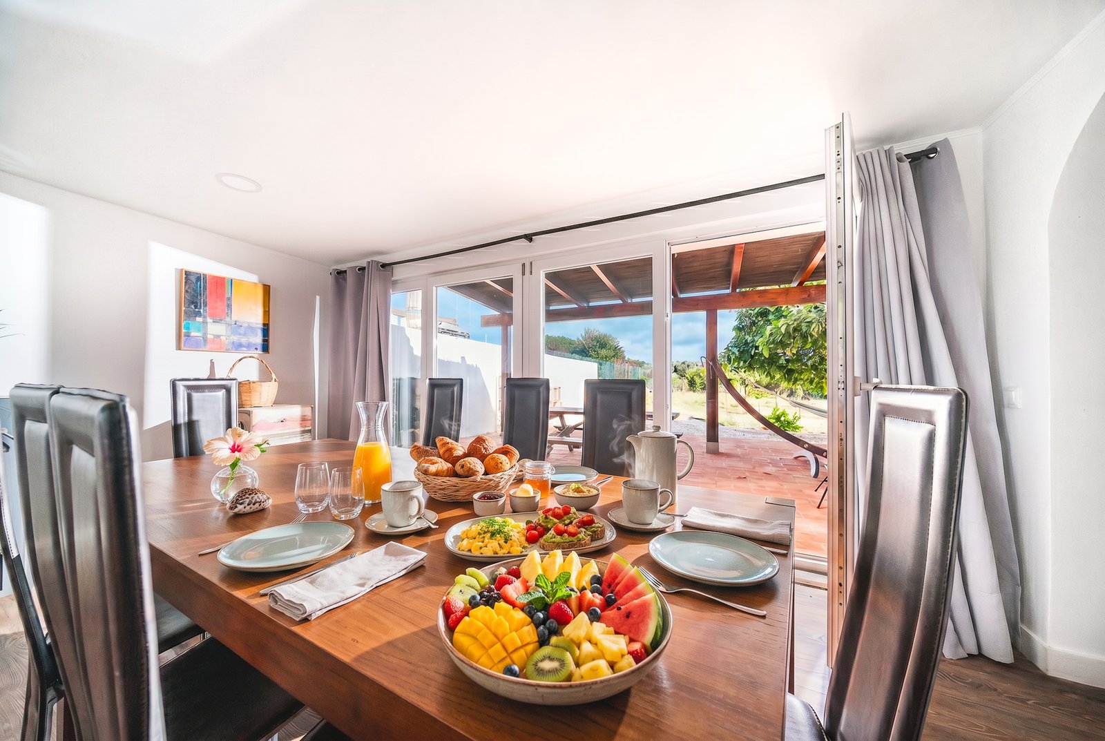 Breakfast table laid with fresh fruit and homemade food by Pina
