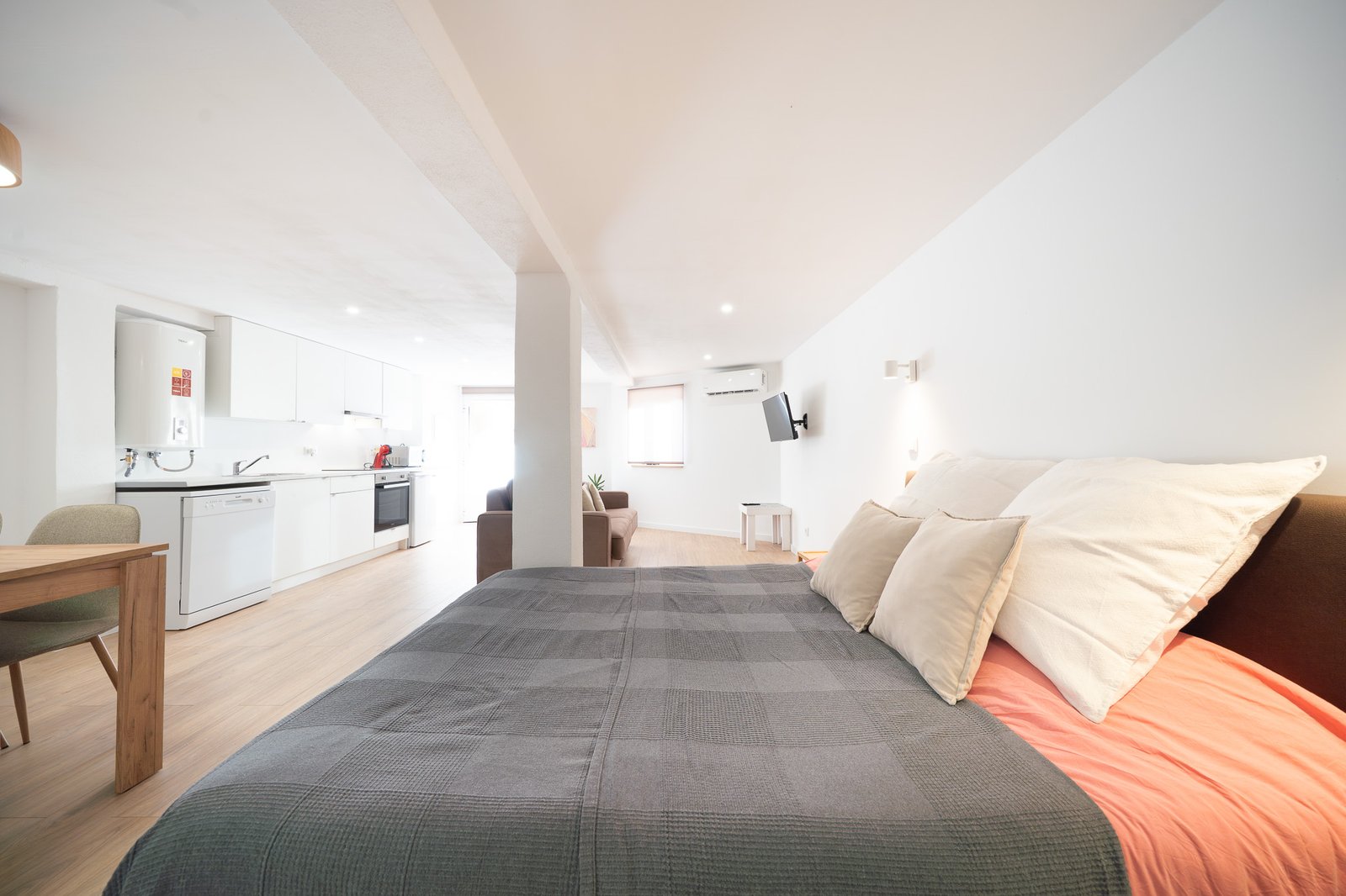 The Studio — open-plan room with double bed and kitchen